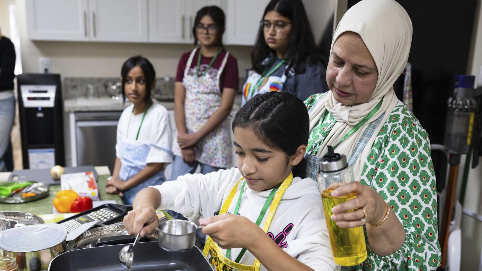 At this summer camp run by grandmas, kids learn cooking skills and life advice